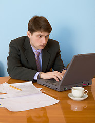 Image showing Businessman on a workplace with the laptop