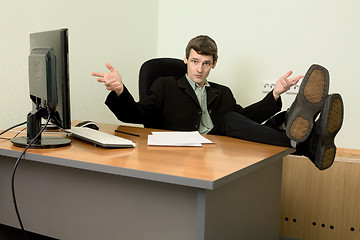 Image showing Boss in black suit on a workplace