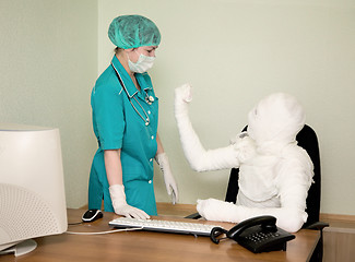 Image showing The bandaged boss and nurse