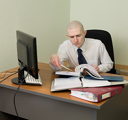 Image showing Bookkeeper on a workplace at office