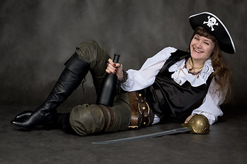 Image showing Girl - pirate with rapier and bottle