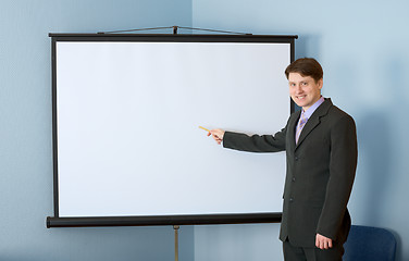 Image showing Businessman near the white screen