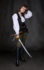 Image showing The girl - pirate with a sabre in hands