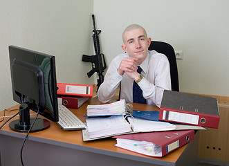 Image showing Self-satisfied worker of office armed with a rifle