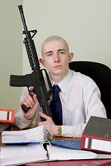 Image showing Accountant armed with a rifle