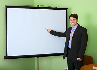 Image showing Businessman near the white screen