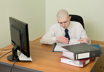 Image showing Bookkeeper on a workplace at office