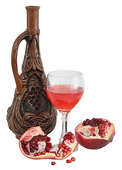 Image showing Glass of wine, bottle and a red pomegranate