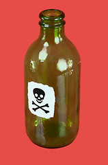 Image showing Green bottle with sticker - skull and crossbones