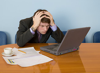 Image showing Businessman on a workplace with the laptop