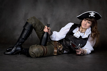 Image showing Girl - pirate with pistol and bottle
