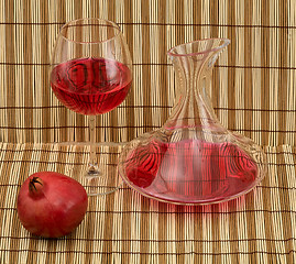 Image showing Stil life with decanter, goblet and pomegranate