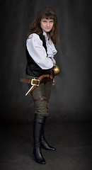 Image showing The girl - pirate with a sabre in hands