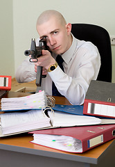 Image showing Accountant armed with a rifle