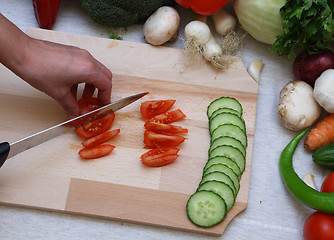 Image showing Hand cutting vegetables