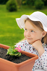 Image showing Little girl   gardening