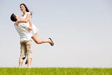 Image showing young Couple Fooling Around On The park