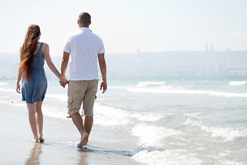 Image showing young couple walk at the beach