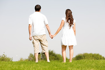 Image showing young couple holding hands