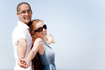 Image showing love couple Stretching Their Hands Together