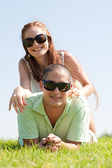 Image showing beautiful young Couple lie down on grass