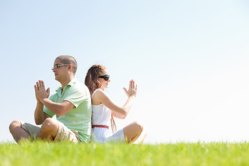 Image showing young couple doing meditating