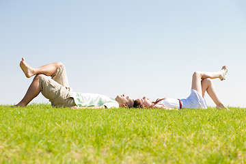 Image showing couple lie down on grass
