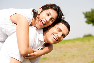 Image showing young Couple Piggybacking