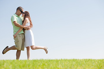 Image showing young Couple Fooling Around On The park