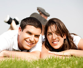 Image showing happy young Couple lie down on grass