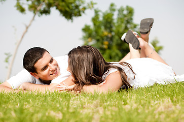 Image showing happy young Couple lie down on grass