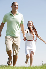 Image showing young Couples Running At Park