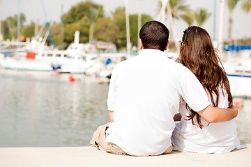 Image showing Young Couple Seated On A Footbridge