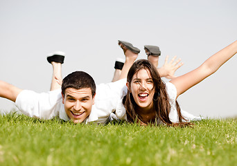 Image showing cute young Couple lie down on grass