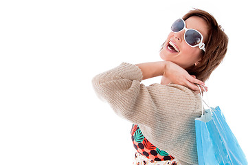 Image showing Happy young woman with shopping bags on white