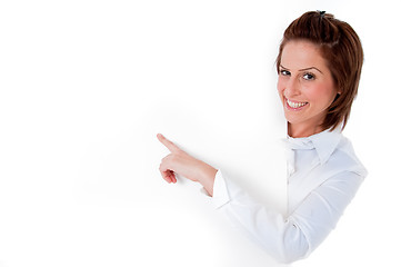 Image showing young woman laughing by a blank board