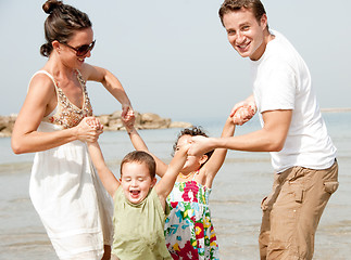 Image showing Family playing on the beach