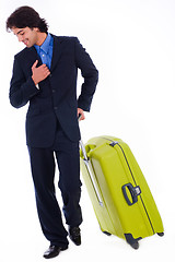 Image showing Corporate man looking down with the luggage
