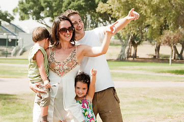 Image showing Happy family see Something