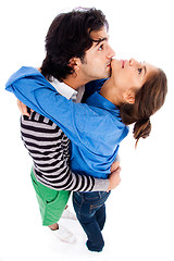 Image showing happy young couple hugging each other