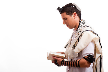 Image showing Side view of young  jewish man with book