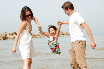 Image showing father and mother hold the daughter