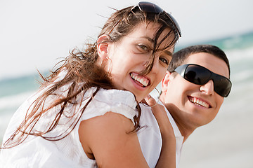 Image showing playful young couple look back and smiling