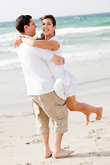 Image showing Happy young couple having fun at the beach