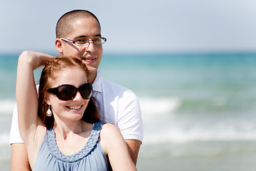 Image showing Young couple holding passionately at the beach