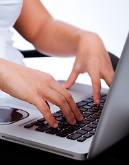 Image showing Hands typing on laptop