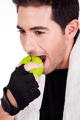 Image showing Fitness man having green apple