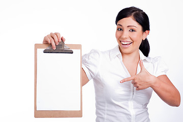 Image showing Lovely woman  Pointing blank Clip board