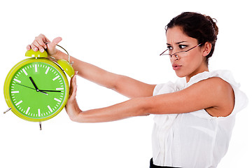 Image showing Shot of a Young business woman holding clock