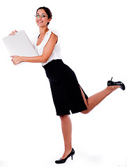 Image showing Business Woman raise his left leg with laptop